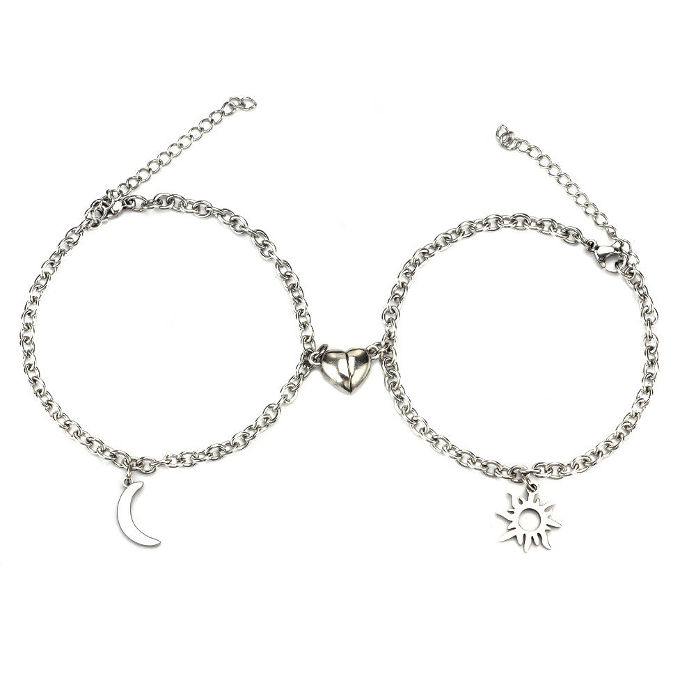 Two silver bracelets with moon and sun charms on a white background