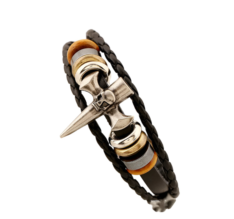 Bracelet with black braided design, silver and gold accents on a white surface.