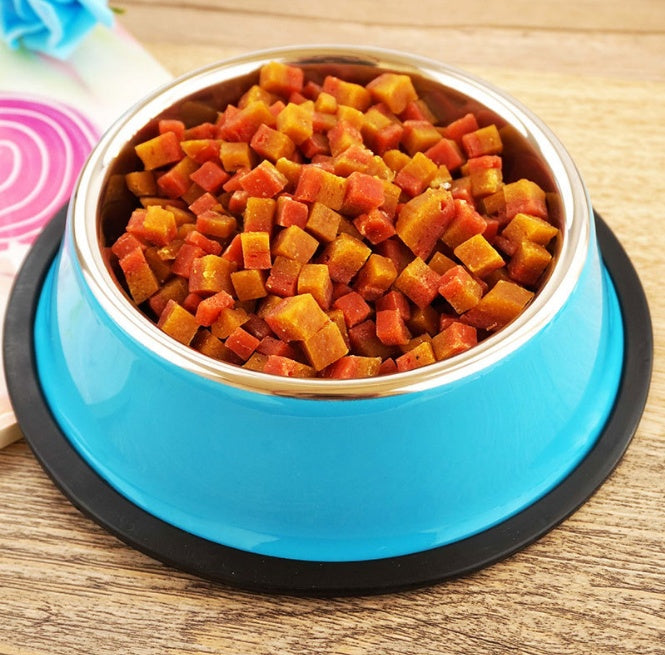 Blue pet bowl filled with dog food on a wooden surface