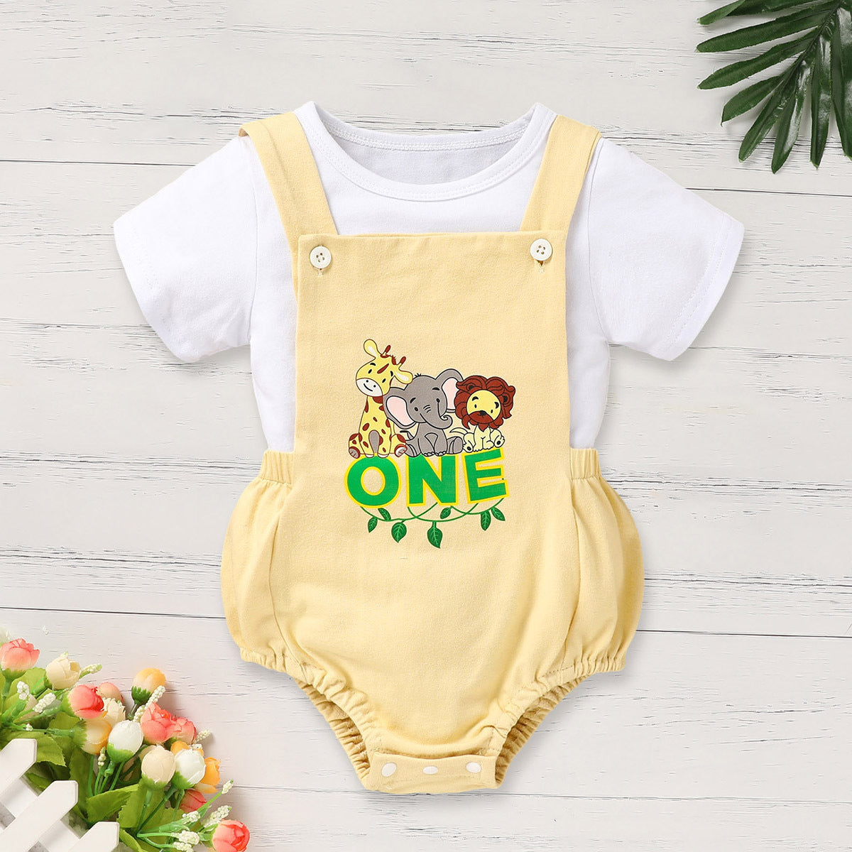 Yellow romper with animal graphics and 'ONE' text on a white background