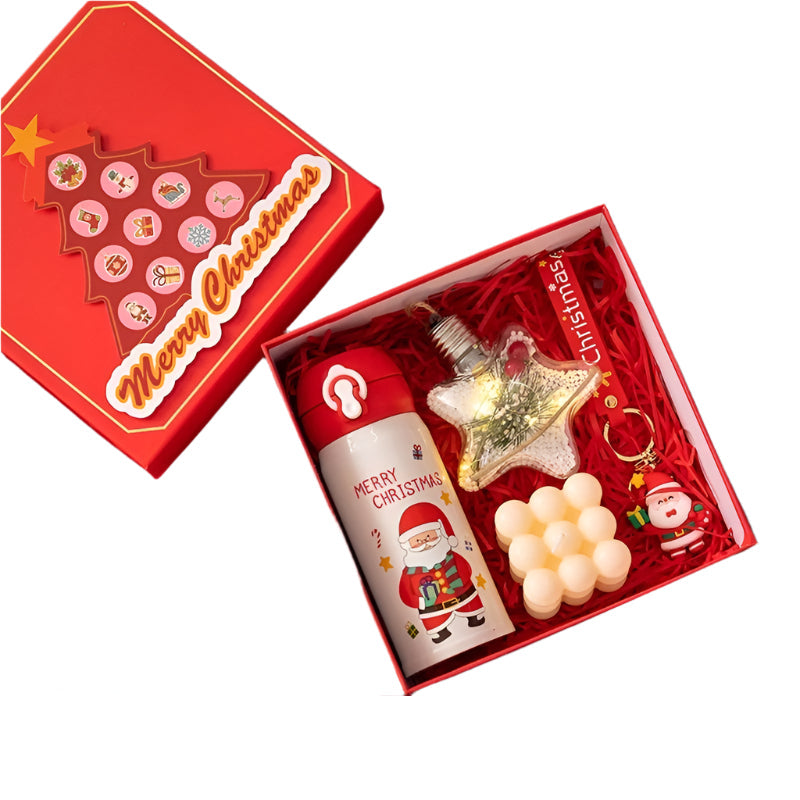 Set of Christmas-themed items including a thermos cup, lights, Rubik's cube candle, and Santa keychain in a red box.