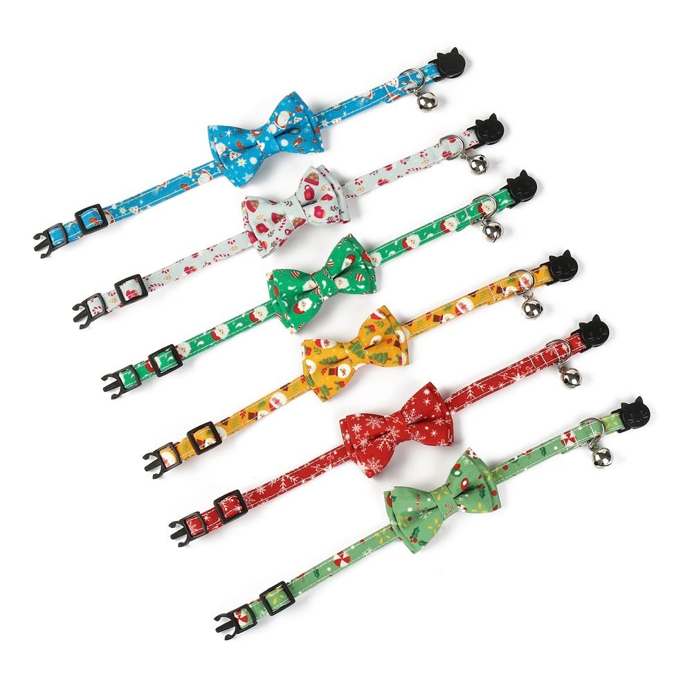 Set of colorful cat collars with bow ties on a white background