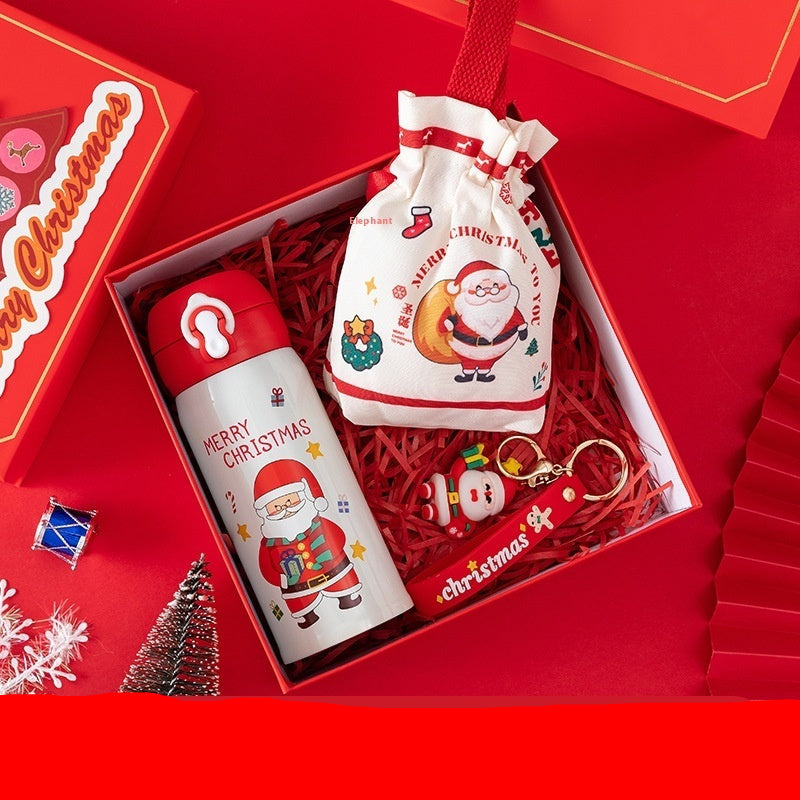 Christmas-themed gift set with thermos, candy bag, and keychain in a red box.