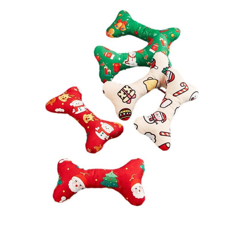 Set of four Christmas-themed dog toys shaped like bones on a white background.