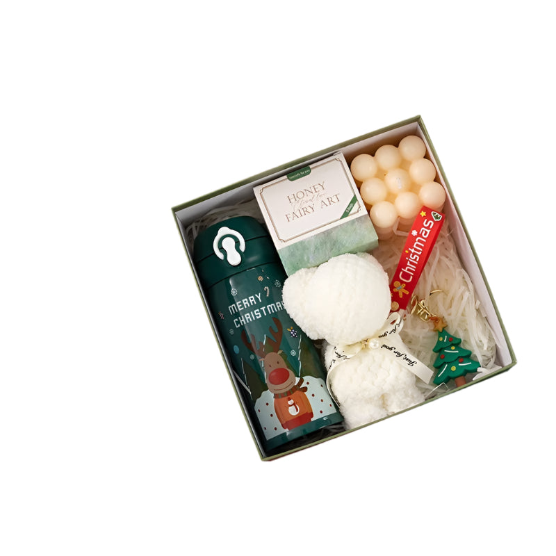 Holiday gift set with Christmas-themed items on a white background