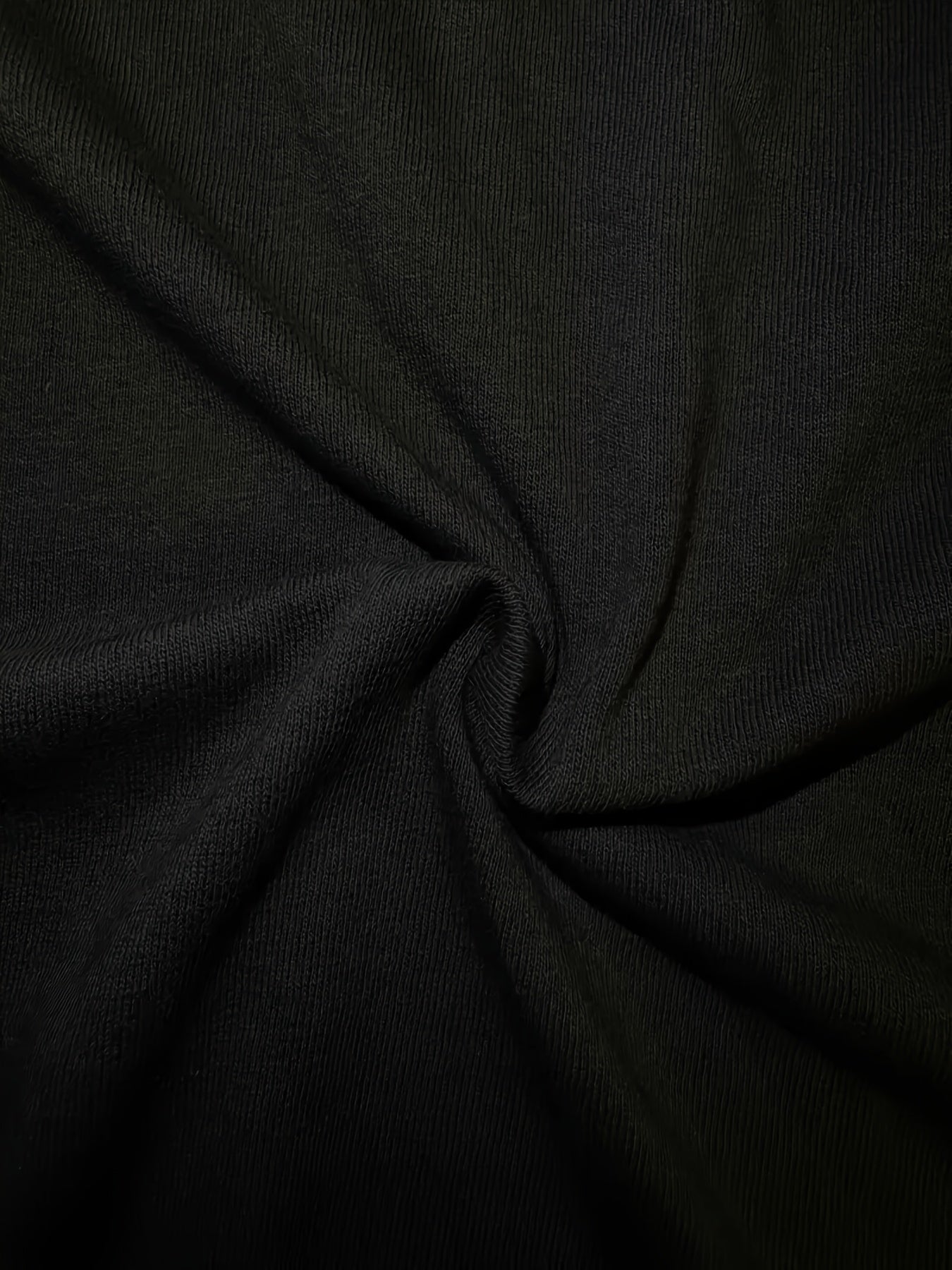 Close-up of black fabric with folds