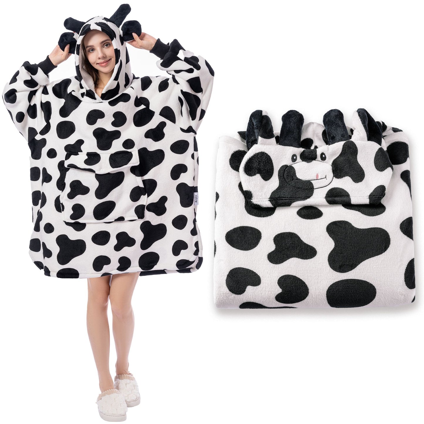 Cow-themed poncho with hood and matching bag on a white background