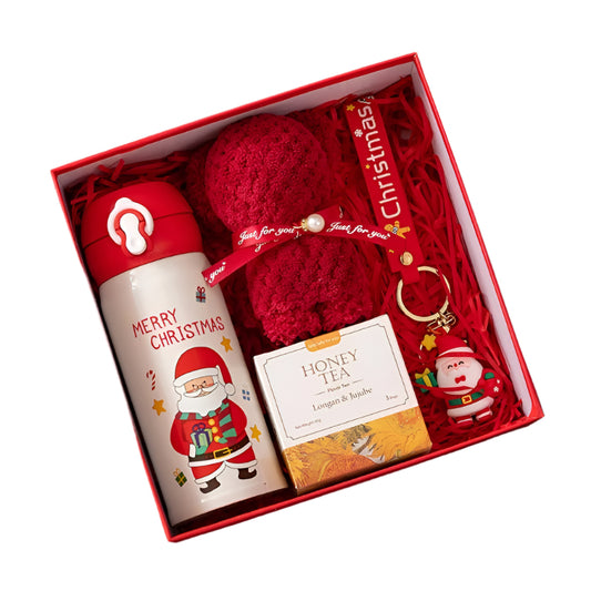 Christmas-themed gift set with water bottle, tea bag, and keychain in a box.