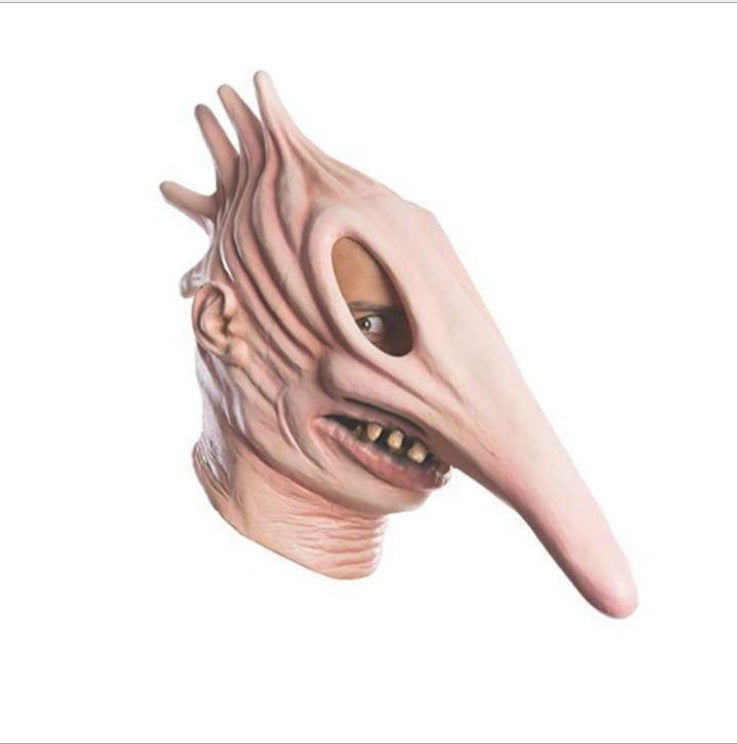 Creepy mask with long nose and spiky features on a white background