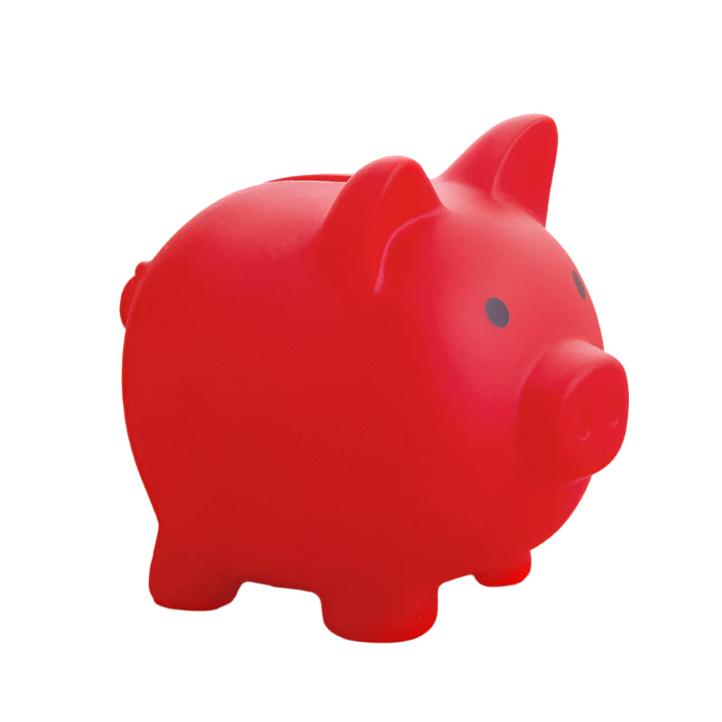 Red piggy bank on a pink surface