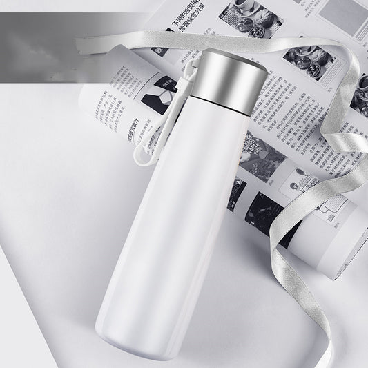 White water bottle with silver lid on a newspaper background