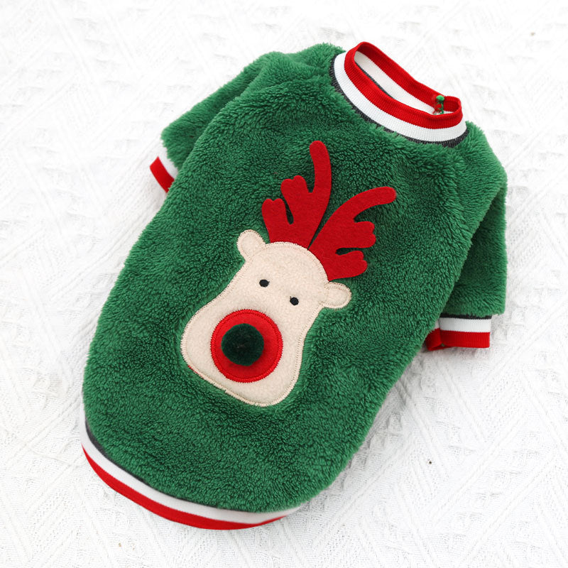 Green dog sweater with reindeer design on a white background