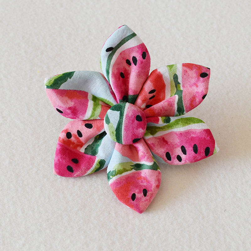 Flower-shaped hair clip with watermelon pattern on a light background