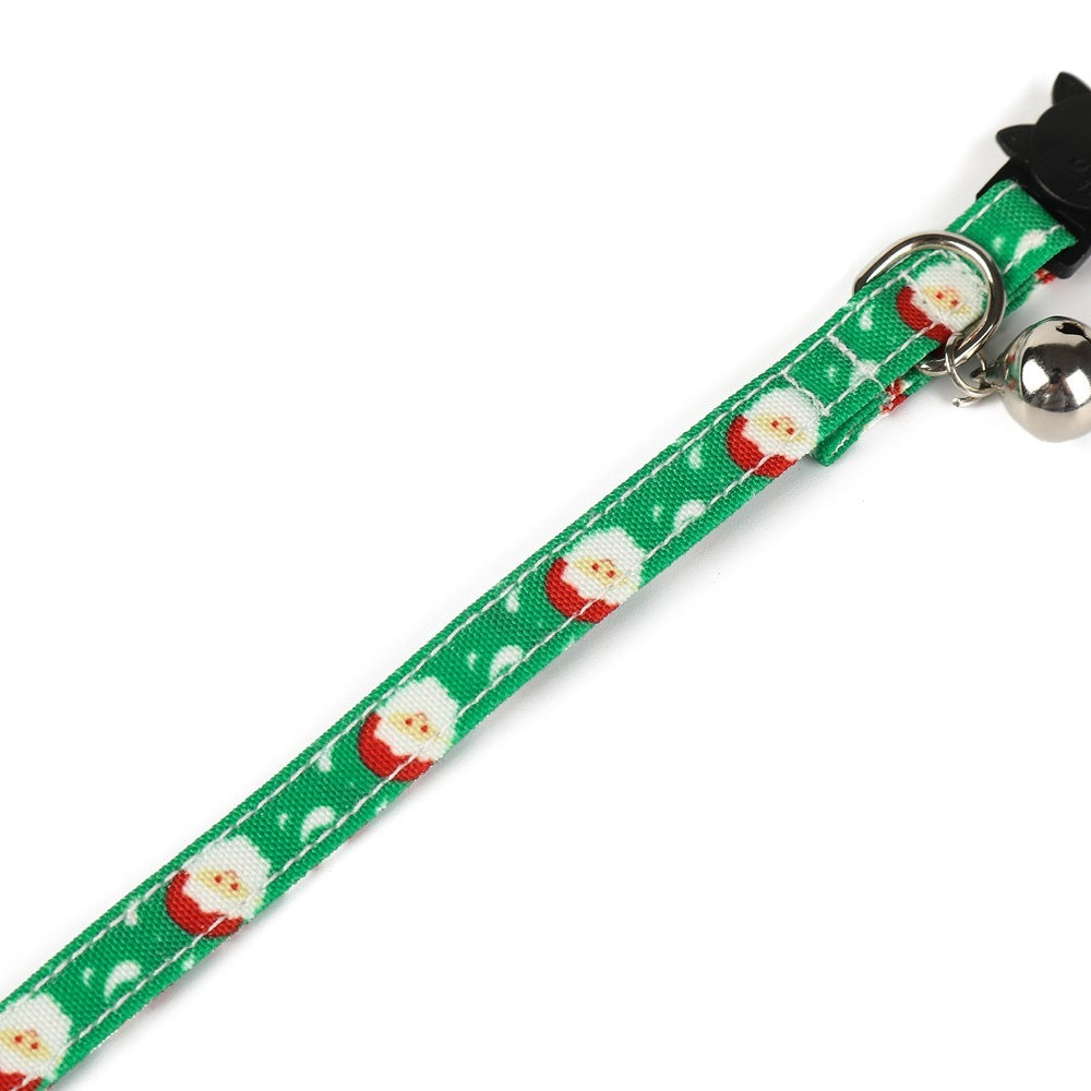 Green cat collar with Santa Claus pattern on a white background