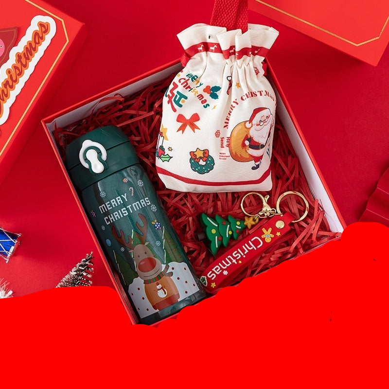 Christmas-themed items including a thermos cup, candy bag, and keychain in a red box.