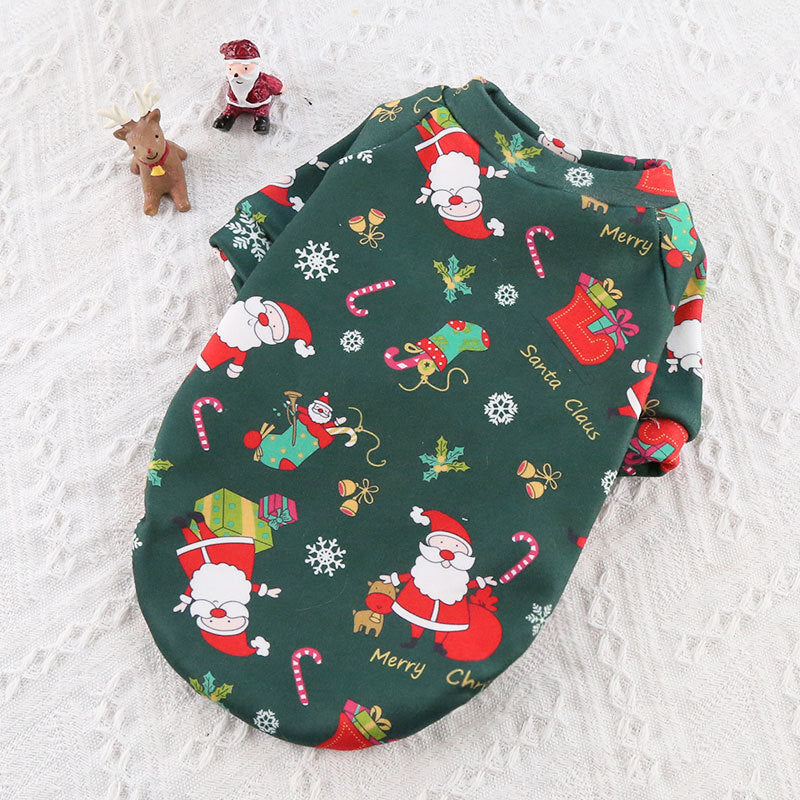 Christmas-themed baby bib with Santa Claus and reindeer pattern on a white textured background
