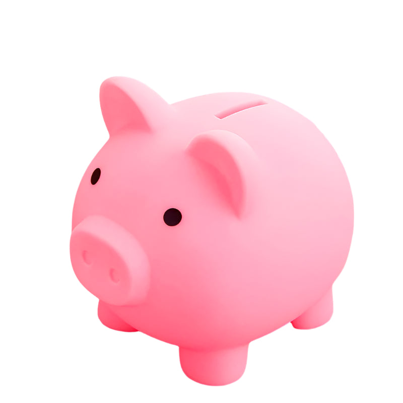 Pink piggy bank on a pink surface with a blurred background