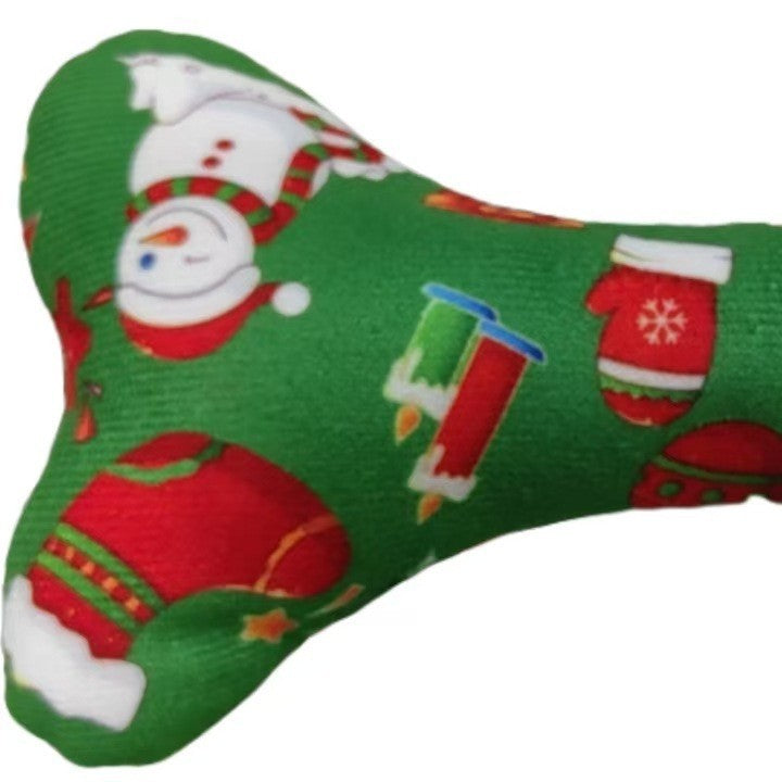 Green fabric patch with Christmas-themed designs on a white background