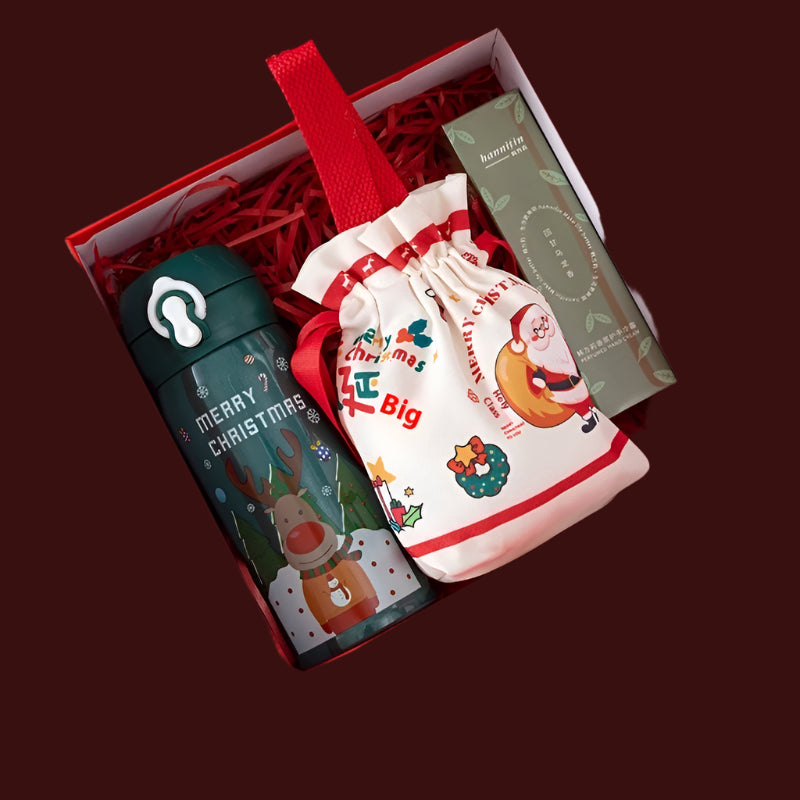 Gift set with Christmas thermos cup, candy bag, and hand cream in a red box.