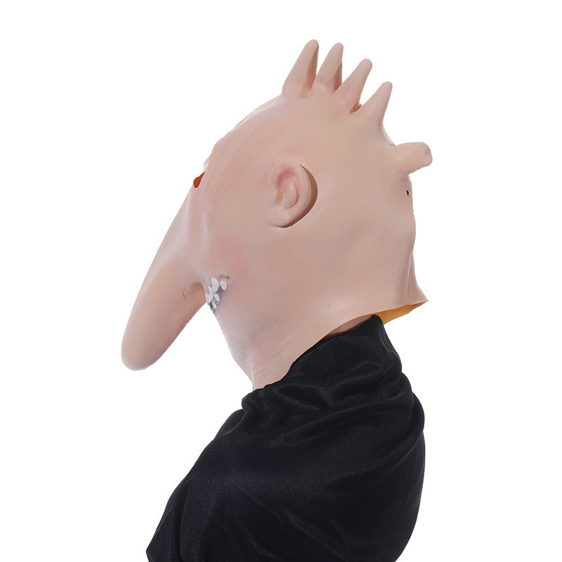 Close-up of a mask with a long nose and black shirt on a white background