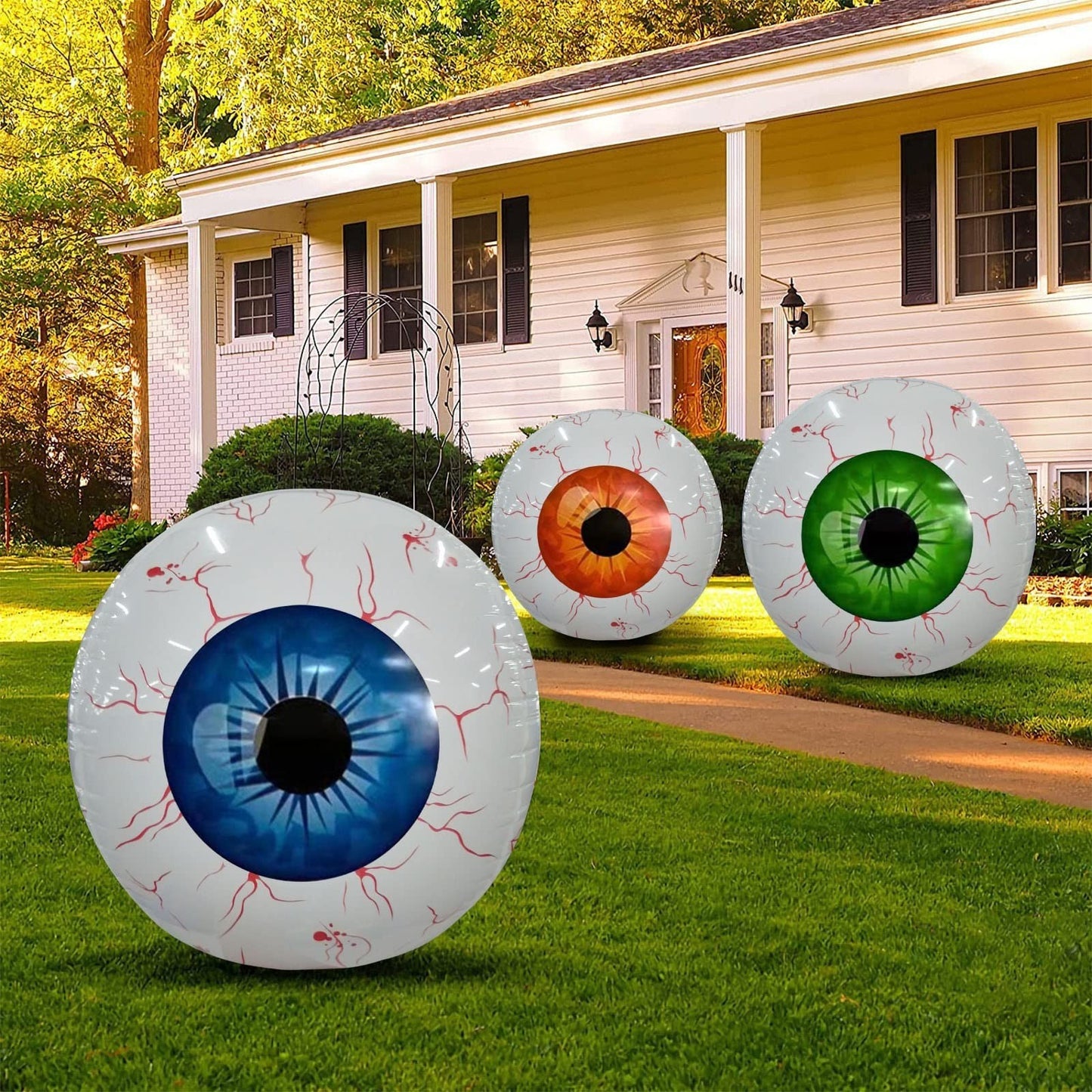 Inflatable eye decorations in front of a house