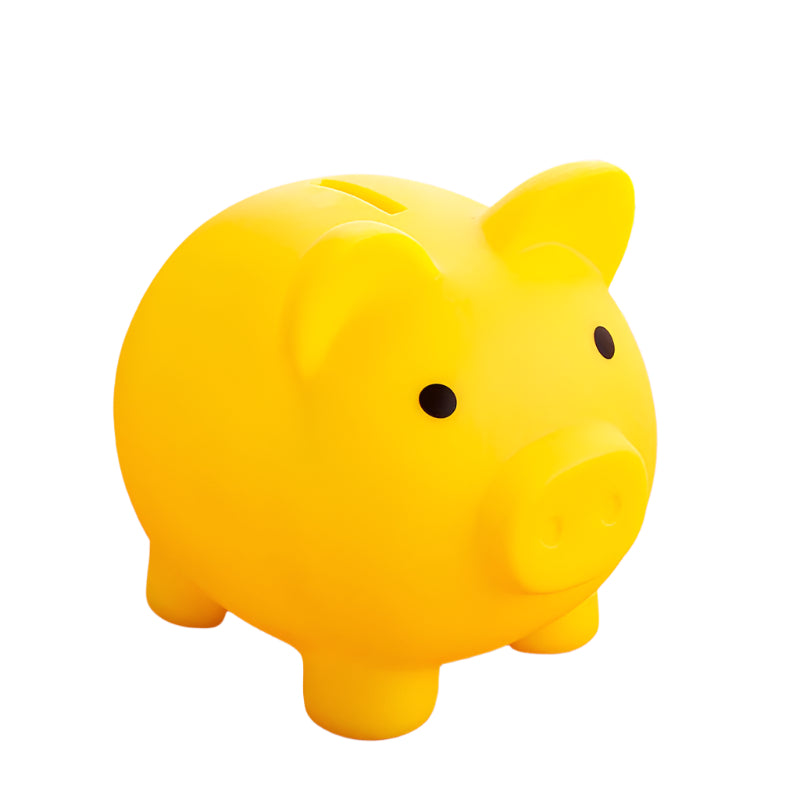 Yellow piggy bank on a pink surface with a blurred background