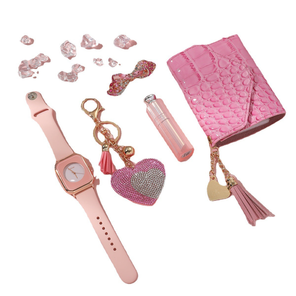 Collection of pink accessories including a watch, keychain, and pouch on a white background