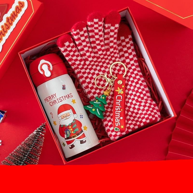 Christmas-themed gift set with thermos, gloves, and keychain in a red box.