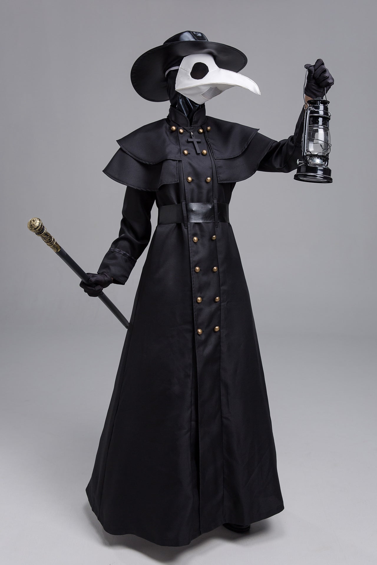Person wearing a black plague doctor costume with a lantern and staff on a gray background