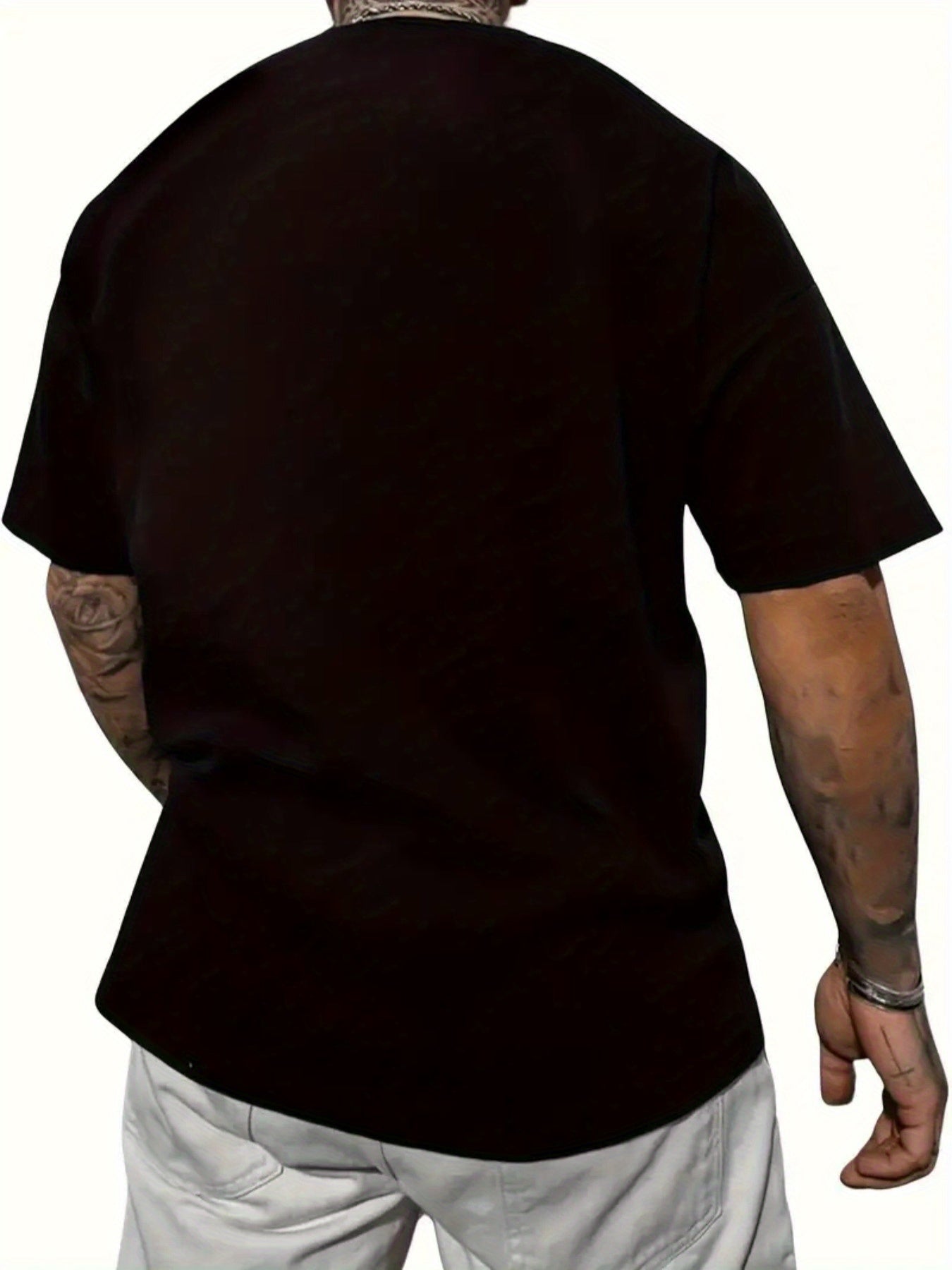 Person wearing a black t-shirt on a white background