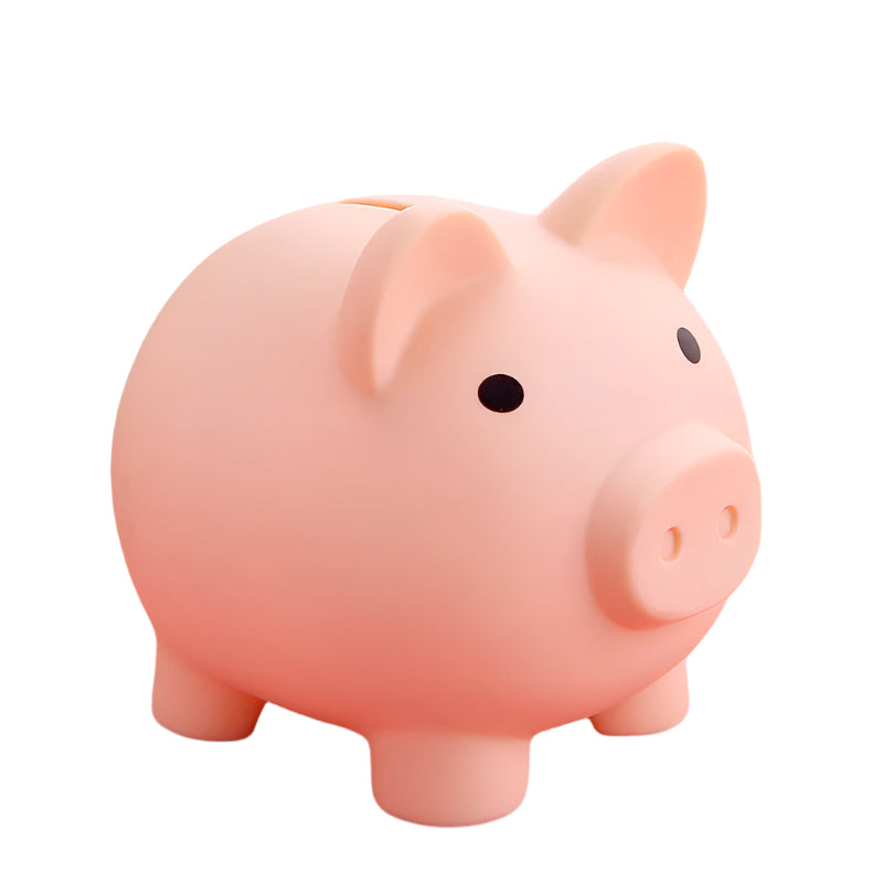 Pink piggy bank on a pink surface with a blurred background