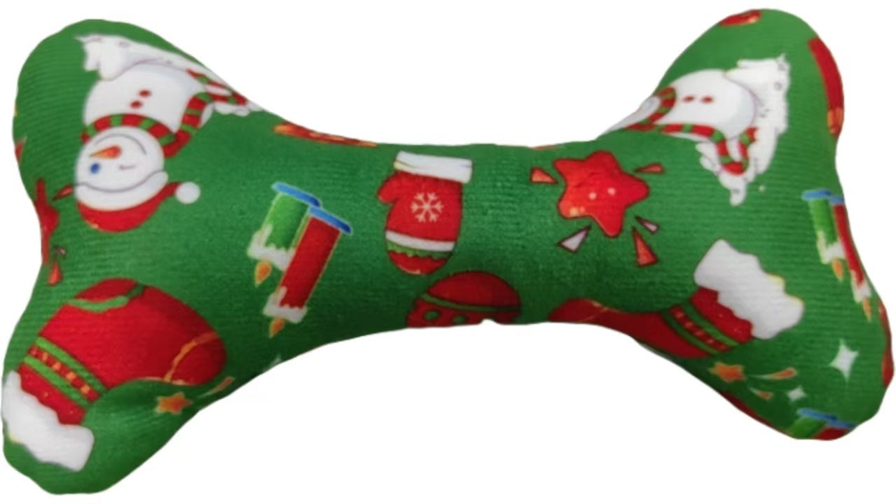Green bone-shaped toy with Christmas-themed patterns on a white background