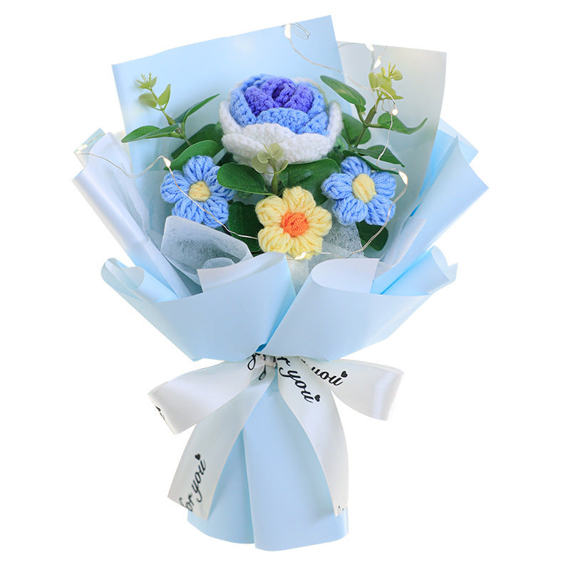 Bouquet of flowers with blue and white paper wrap on a white background