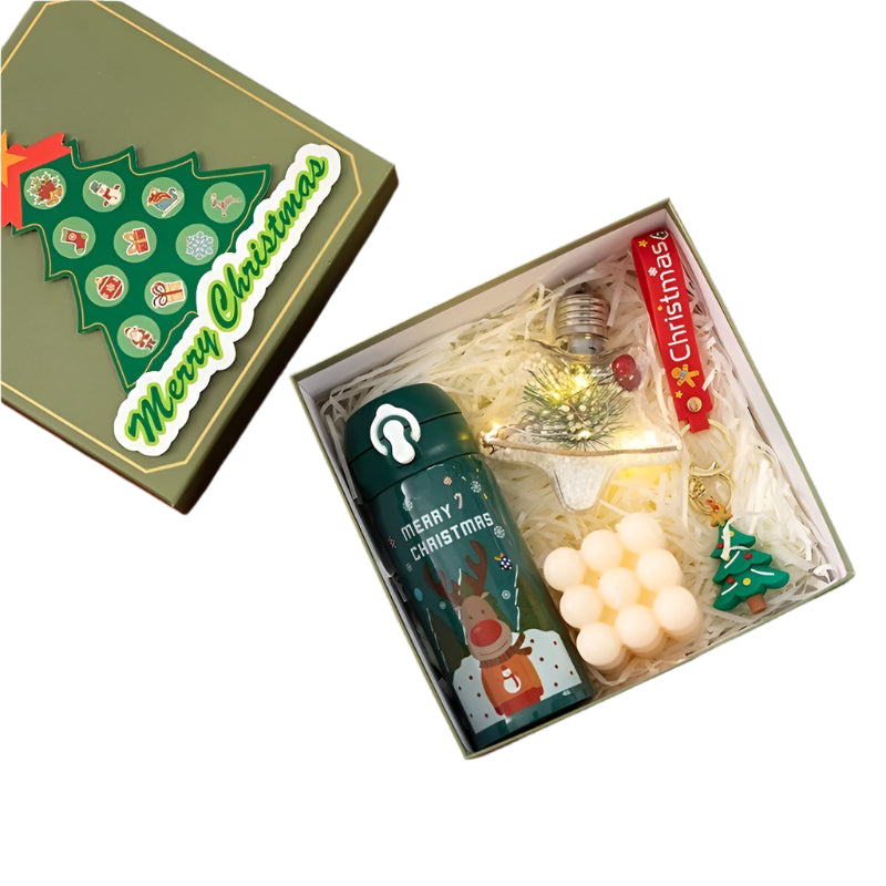 Christmas-themed gift set with thermos cup, Rubik's Cube, candle, lights, and key pendant on a white background.