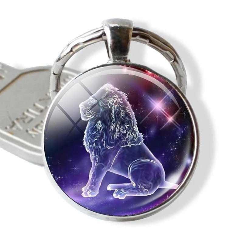 Keychain with a lion design on a purple background, featuring the brand 'Zodiac Jewelry'.