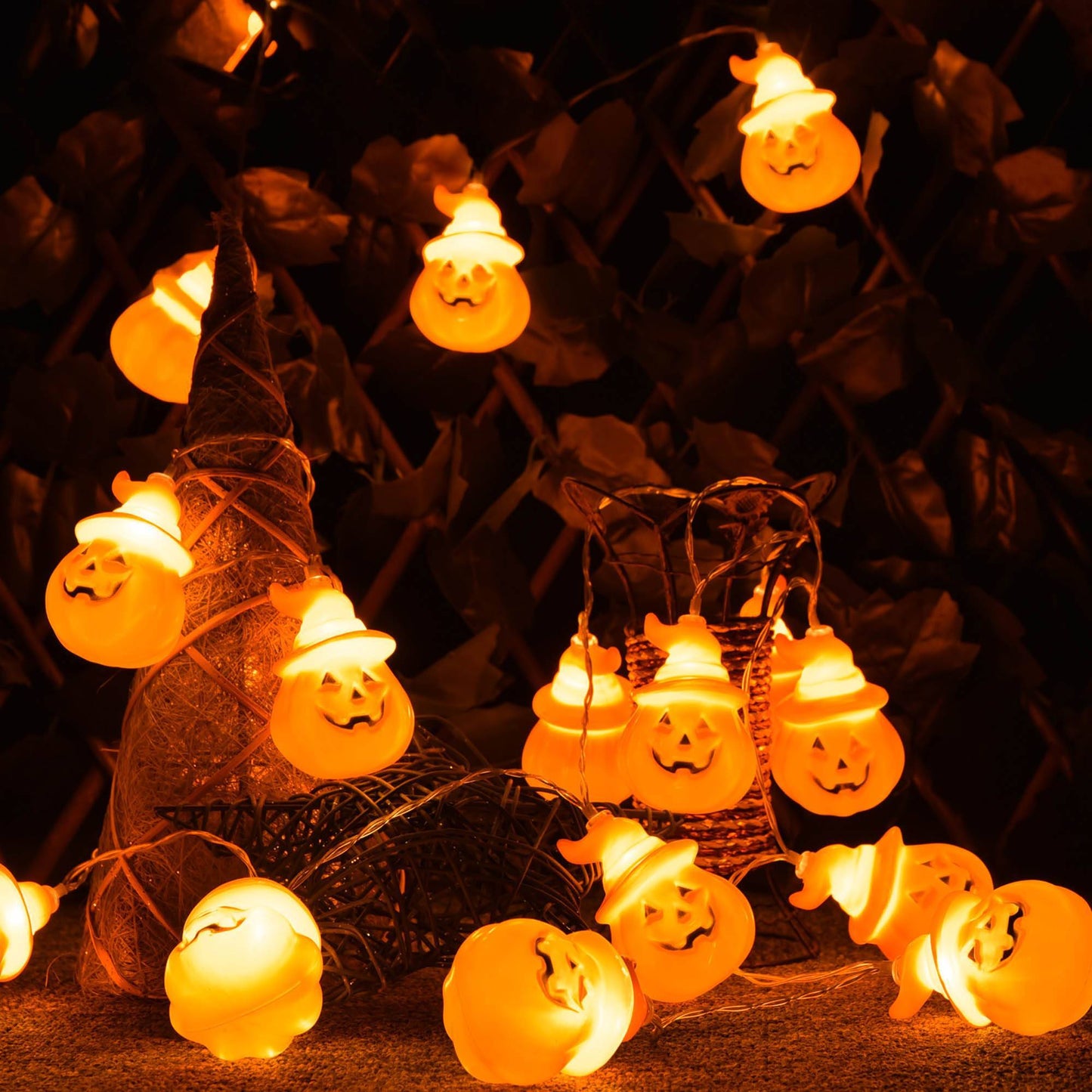 String of pumpkin-shaped lights on a dark background
