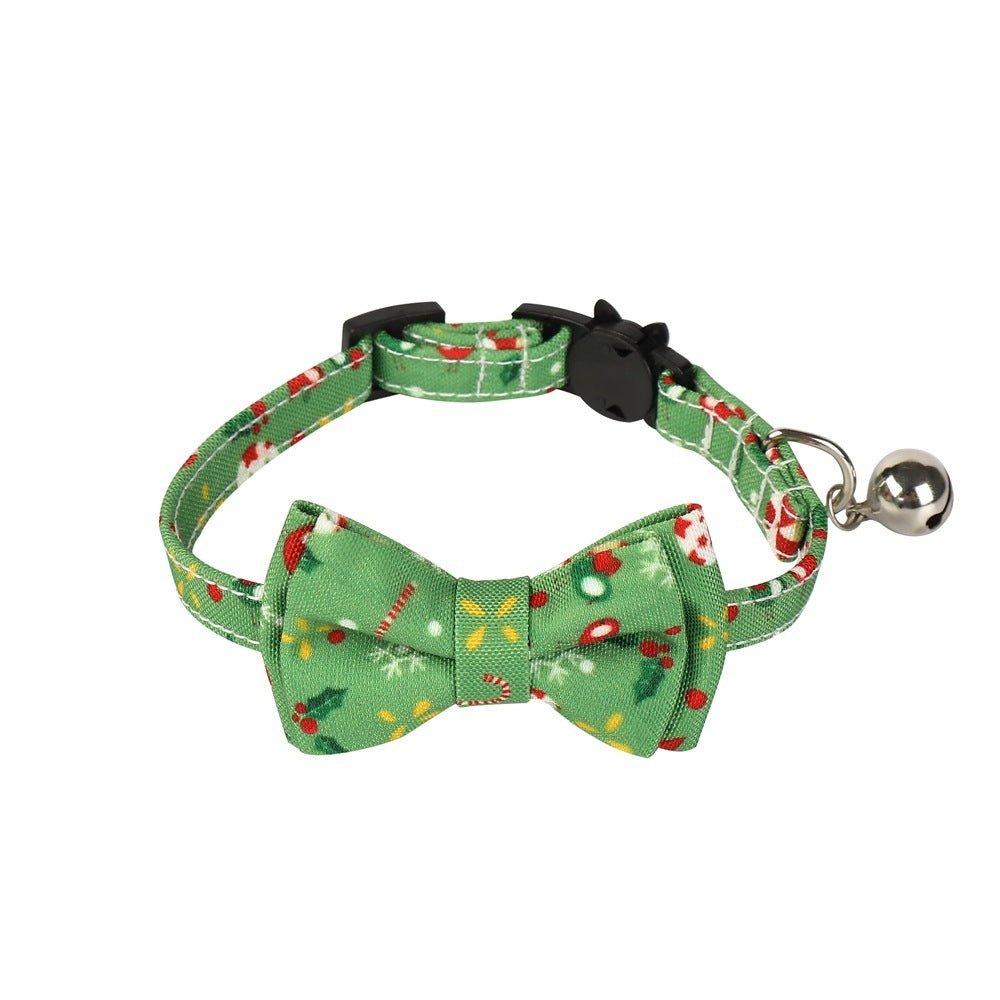 Green patterned bow tie collar with bell on a white background