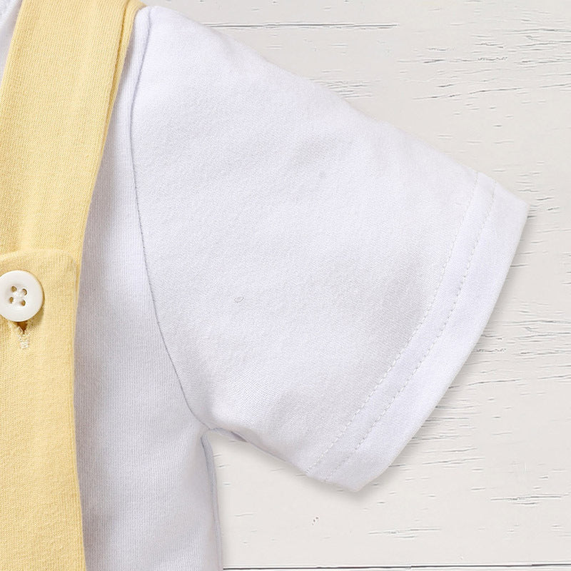 Close-up of a yellow shirt with a white collar on a light wooden surface