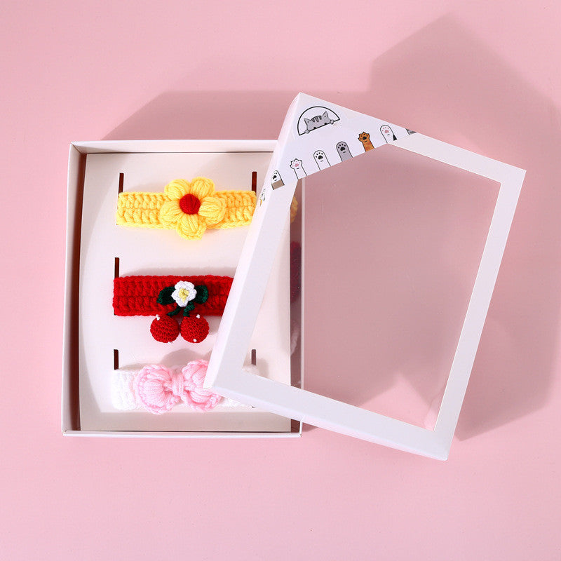 Set of colorful headbands in a box on a pink background