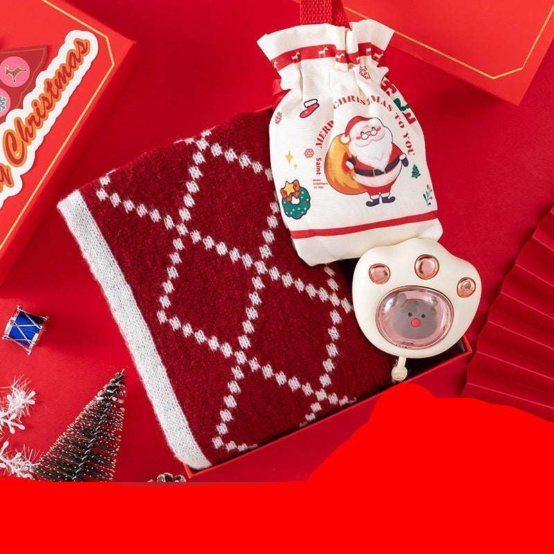Red scarf, Christmas candy bag, and hand warmer on a red background with 'Christmas' text.