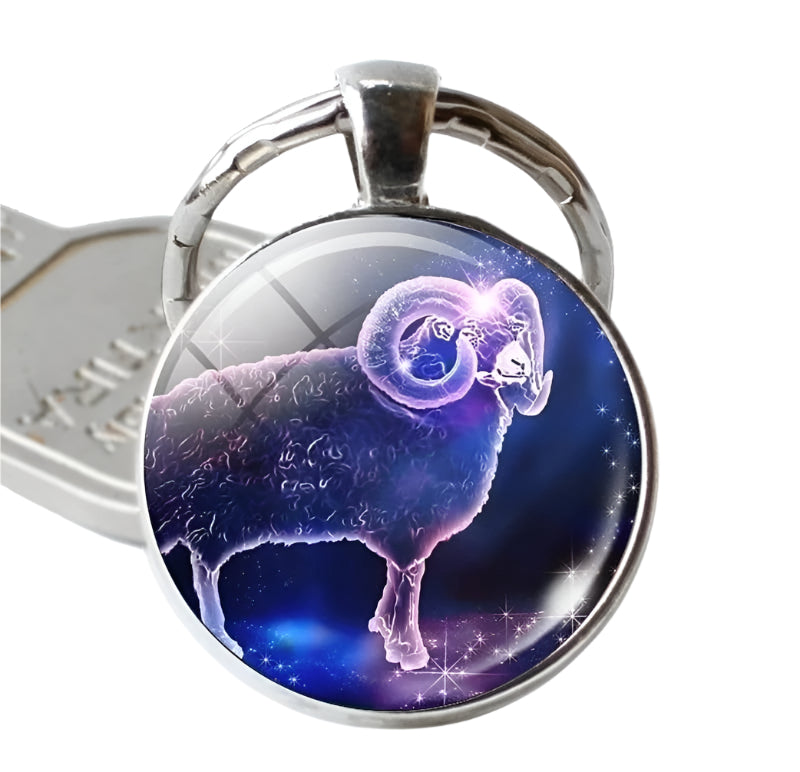 Keychain with a zodiac sign design on a blue background