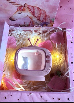 Unicorn-themed product with 'Guard Love Eternal' packaging on a pink background