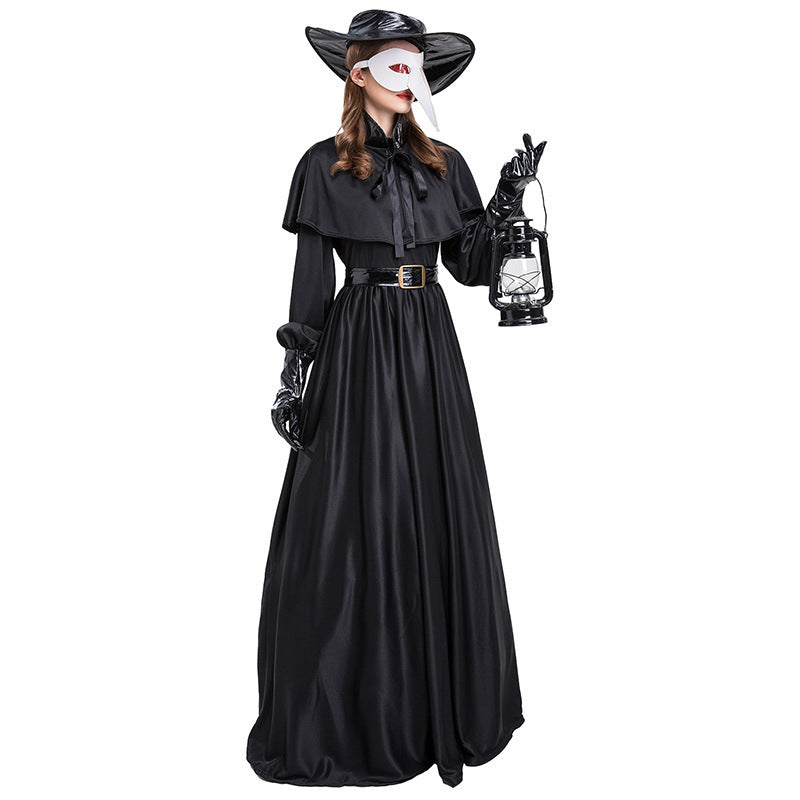 Person wearing a black Halloween costume with a lantern on a white background
